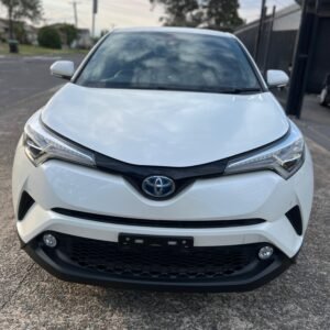 2018 Toyota C-HR Hybrid SUV, low mileage, leather interior, Apple CarPlay, reverse camera, blind spot monitor, eco-friendly engine, and advanced safety features.
