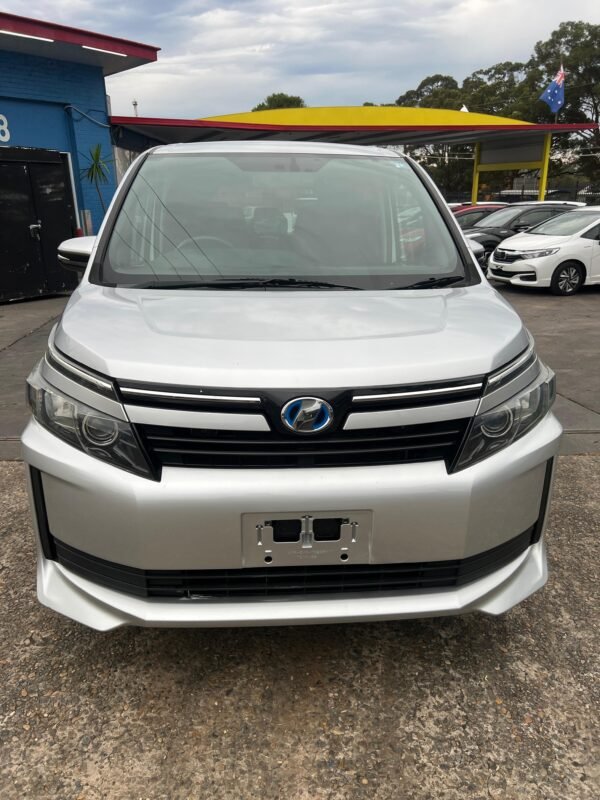 2015 Toyota Voxy Hybrid, 7-seater MPV, low mileage, fuel-efficient hybrid, lane assist, rear view camera, Android Auto, Apple CarPlay, spacious interior, available at Umer Motors Villawood.